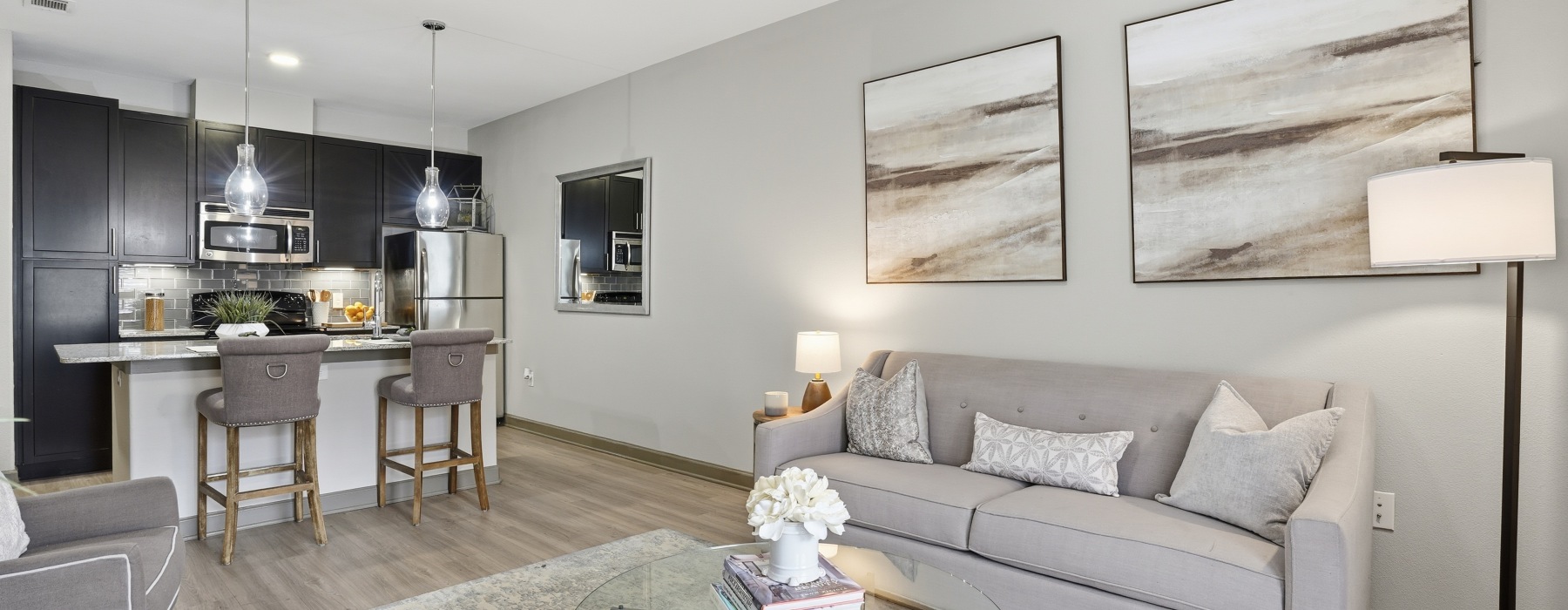 a living room with couch and kitchen
